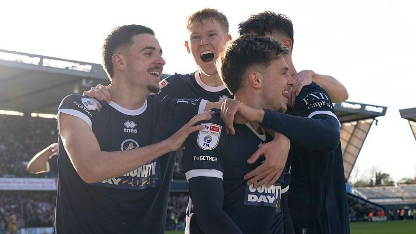Millwall players Camiel Neghli, Josh Coburn, Luke Cundle and Mihailo Ivanovic