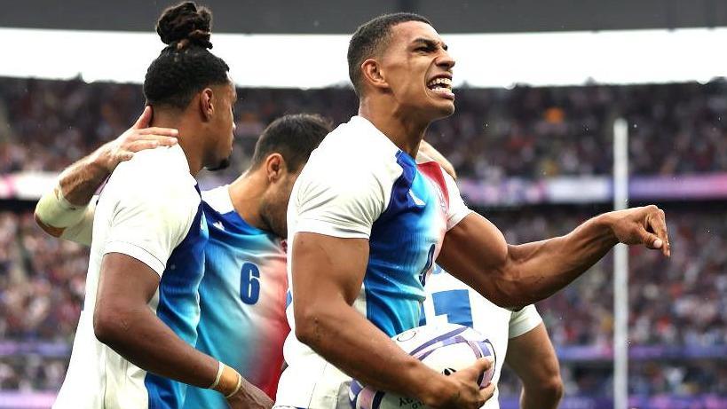 Aaron Grandidier Nkanang celebrates scoring a try against Fiji at Paris 2024