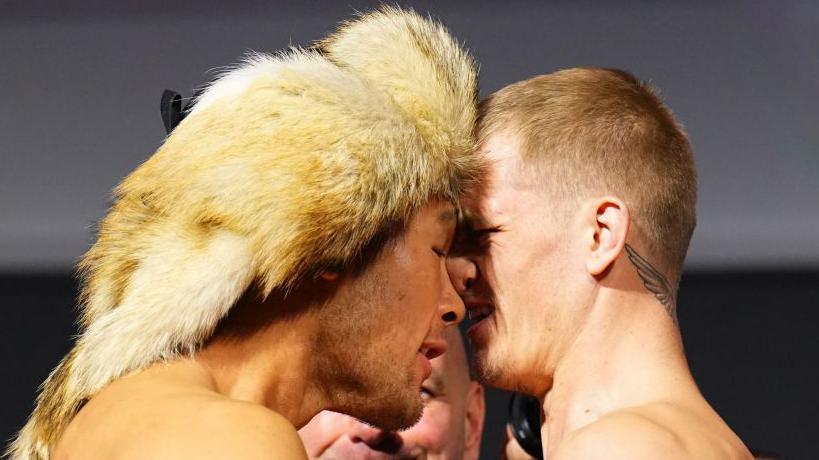 Shavkat Rakhmonov shoves his forehead into Ian Machado Garry's at a UFC weigh-in