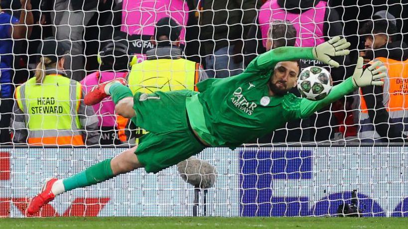 Gianluigi Donnarumma  saves a penalty in PSG's shootout win over Liverpool