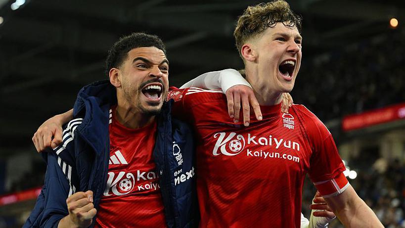 Morgan Gibbs-White and Ryan Yates celebrate in front of the Forest fans at Amex Stadium