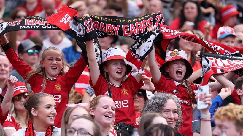 Manchester United fans show their support from the stands prior to the Barclays Women´s Super League match between Manchester United and Chelsea FC