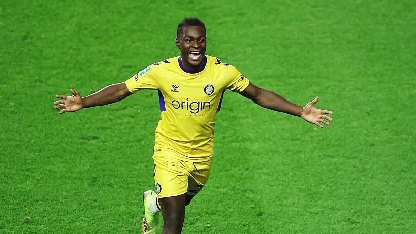 Donnell McNeilly of Wycombe celebrates a goal