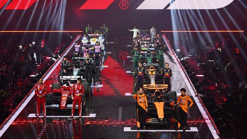 All the 2025 F1 drivers line up alongside the liveries of their cars at the F1 75 launch event at the O2 Arena