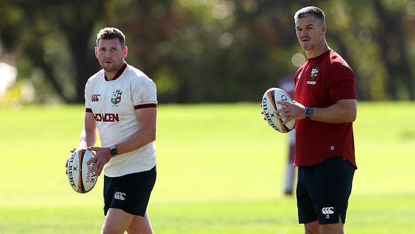 Finn Russell and Lions assistant coach Jonathan Sexton in training