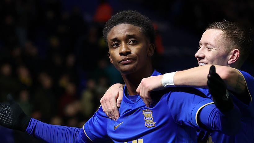 Demarai Gray celebrates
