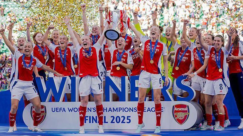 Arsenal's players celebrate lifting the Women's Champions League trophy