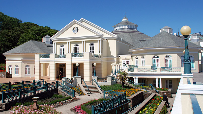 Landscape shot of the Villa Marina in Douglas, Isle of Man. It was taken on a sunny day with the white-walled facade shining in the light. 