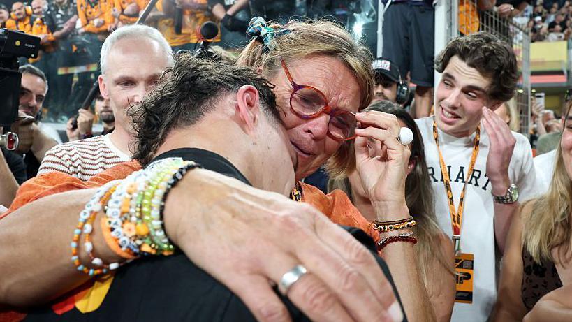 Lando Norris celebrating with his mum after becoming world champion at the Abu Dhabi Grand Prix 