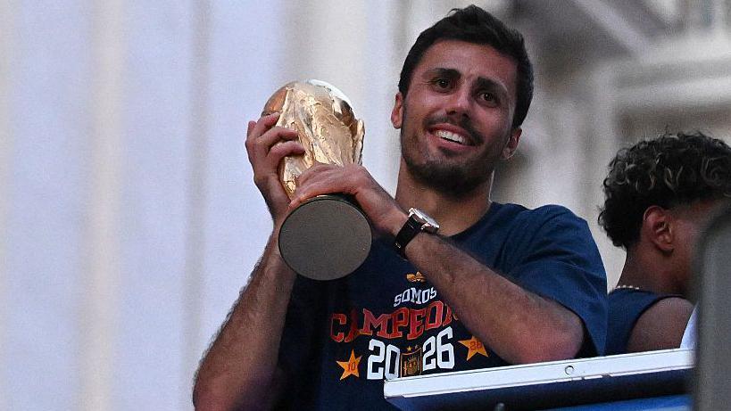 Rodri with the trophy
