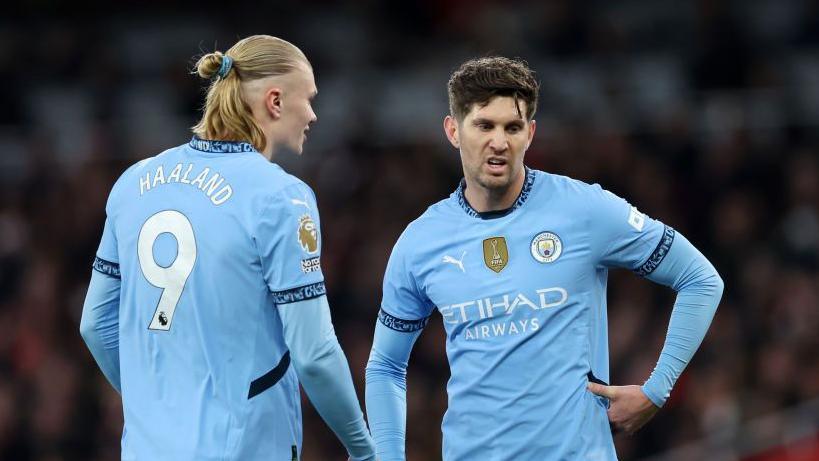 Erling Haaland and John Stones