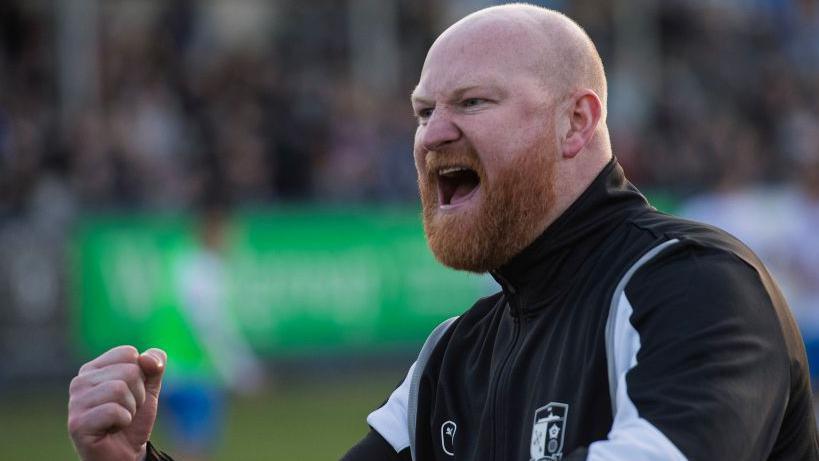 Barrow boss Andy Whing fires a message to his players from the touchline