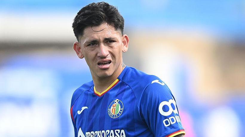 Luis Vazquez in action for Getafe in La Liga. He is wearing a royal blue coloured shirt.