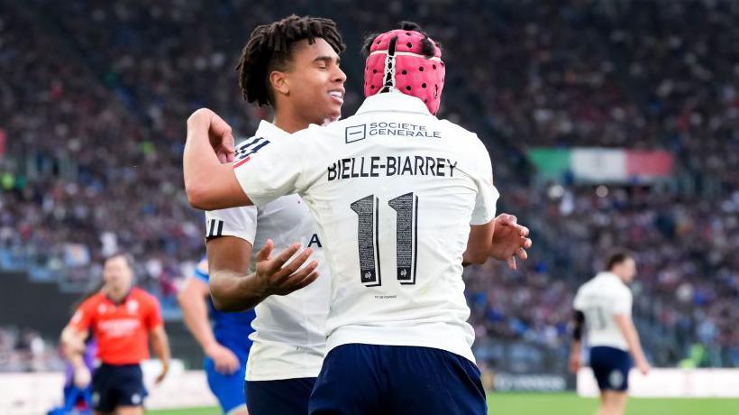 Louis Bielle-Biarrey of France celebrates with Theo Attissogbe