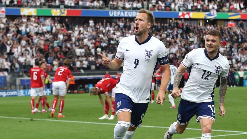 Harry Kane celebrates after scoring against Denmark