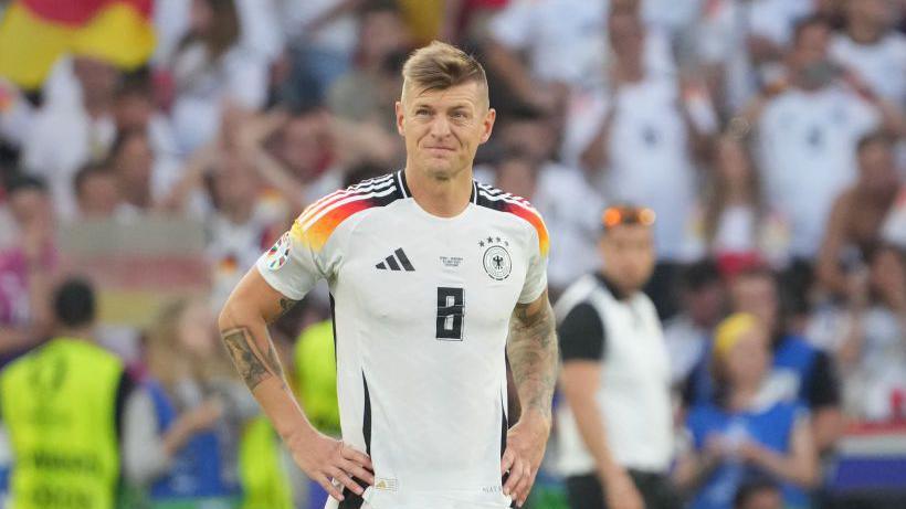 Toni Kroos looks on after Germany's defeat by Spain