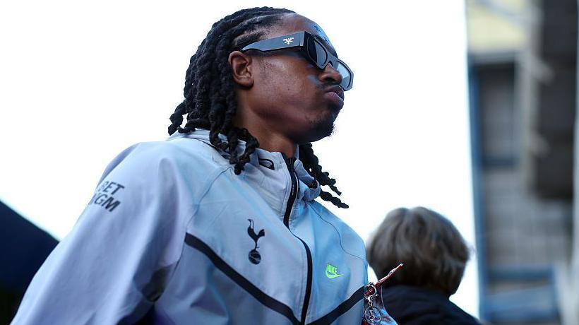 Tottenham's Djed Spence arrives for a Premier League game against Chelsea at Stamford Bridge, where he made a rare appearance on the right.