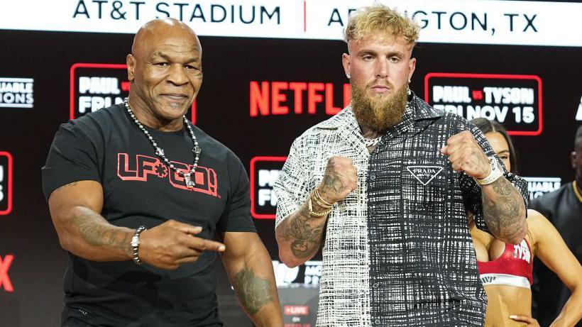 Mike Tyson and Jake Paul pose side by side