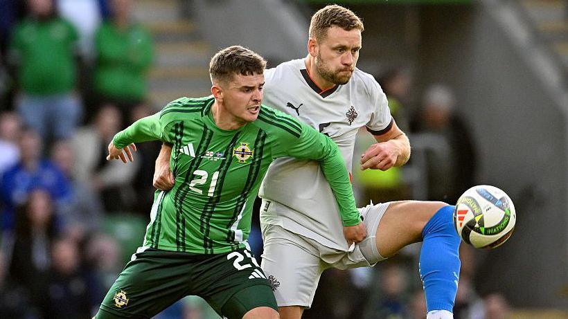 Northern Ireland's Ronan Hale and Iceland's Sverrir Ingi Ingason competing for the ball during an international friendly.