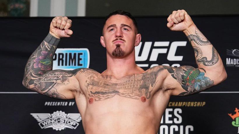 Tom Aspinall weighs in as the backup fighter for the main event at UFC 309 in New York