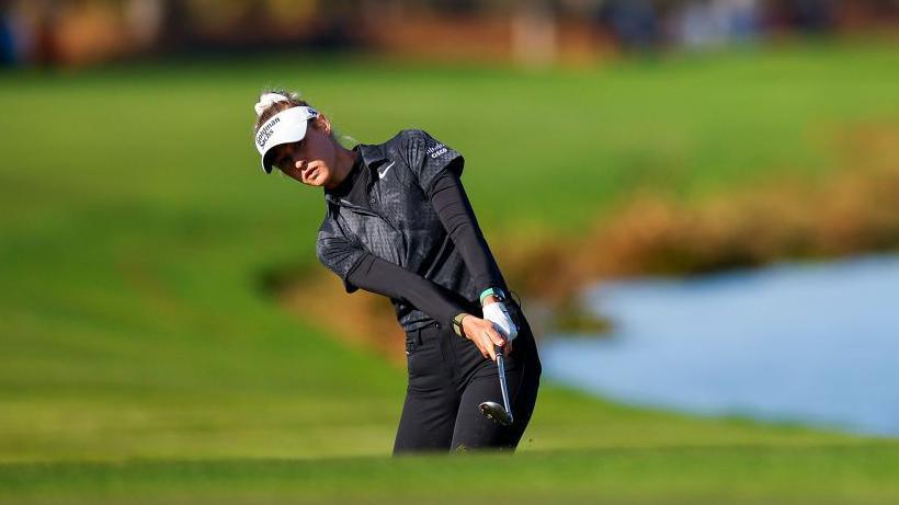 Nelly Korda hits a chip shot on the 18th hole during the first round of the PNC