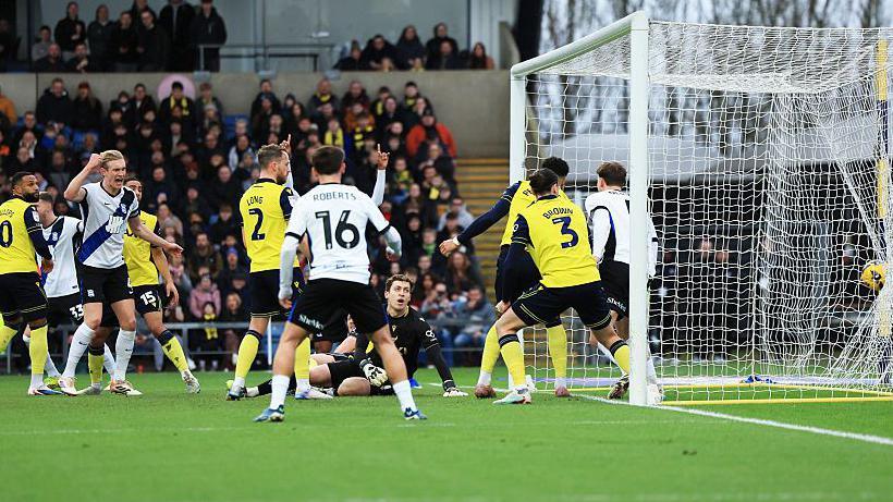 Oxford's Myles Peart-Harris gets the final touch on the line for Birmingham's opening goal.