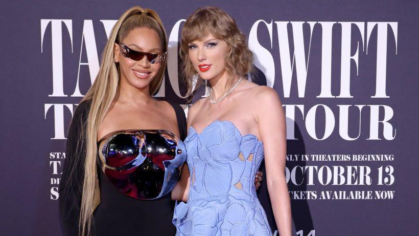 Beyonce and Taylor Swift pose at the US premiere of Swift's Eras Tour movie in 2023