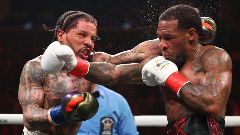 Gervonta Davis exchanges punches with Lamont Roach Jr during their WBA lightweight title bout