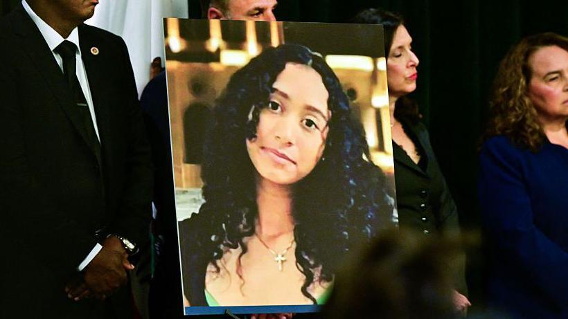A photo of 14 year-old Celeste Rivas Hernandez on display as Los Angeles District Attorney Nathan Hochman announces murder charges to be filed against D4vd, David Anthony Burke in connection to the murder of the 14 year-old