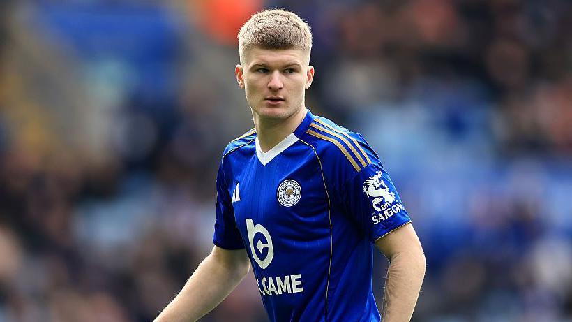 Jordan James in a blue Leicester shirt in action during a game