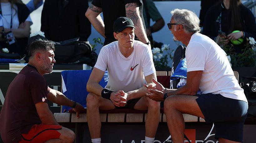 Jannik Sinner (centre) has parted company with physiotherapist Ulises Badio (left) and trainer Marco Panichi (right)
