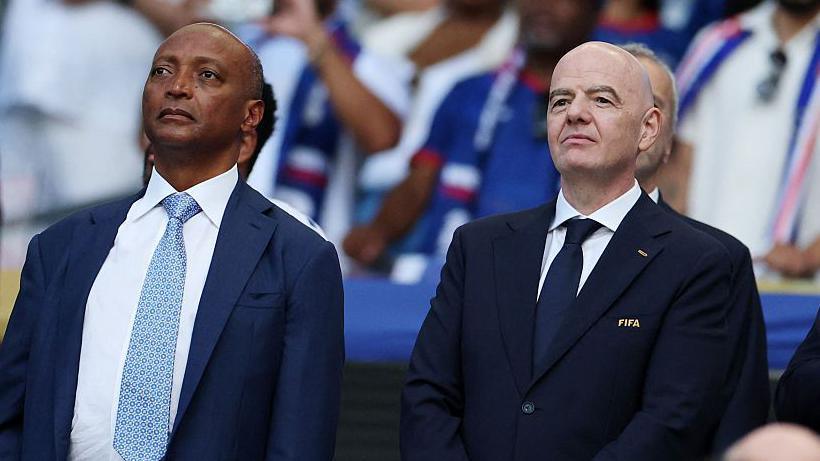 President of the Confederation of African Football Patrice Motsepe and FIFA President Gianni Infantino are seen ahead of the 2026 World Cup Group H football match between Uruguay and Cape Verde at the Miami Stadium in Miami Gardens on June 21, 2026.