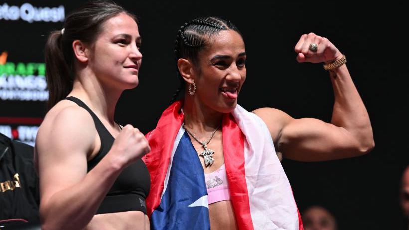 Katie Taylor smiles with her fist up while Amanda Serrano sticks her tongue out while flexing