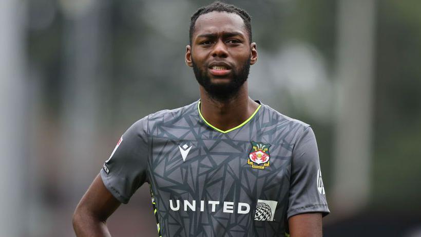 Goalkeeper Arthur Okonkwo in action for Wrexham