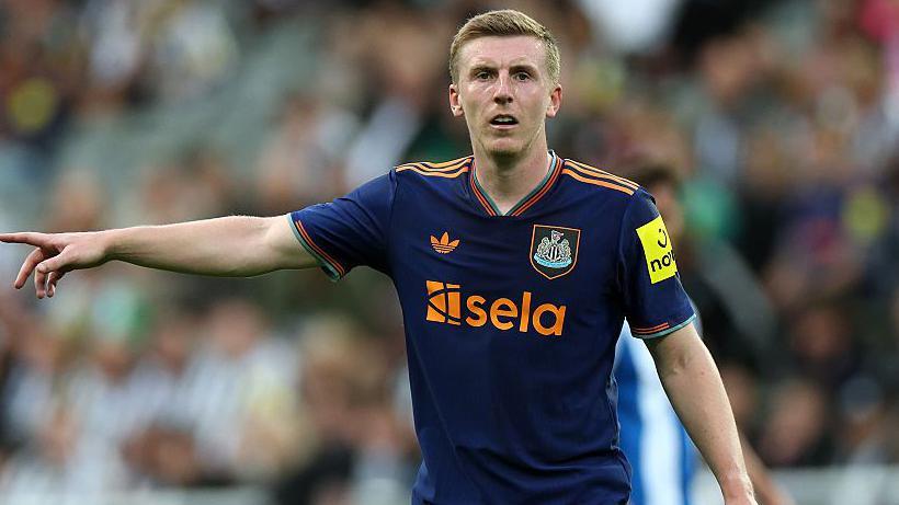 Matt Targett makes a point in action for Newcastle last season