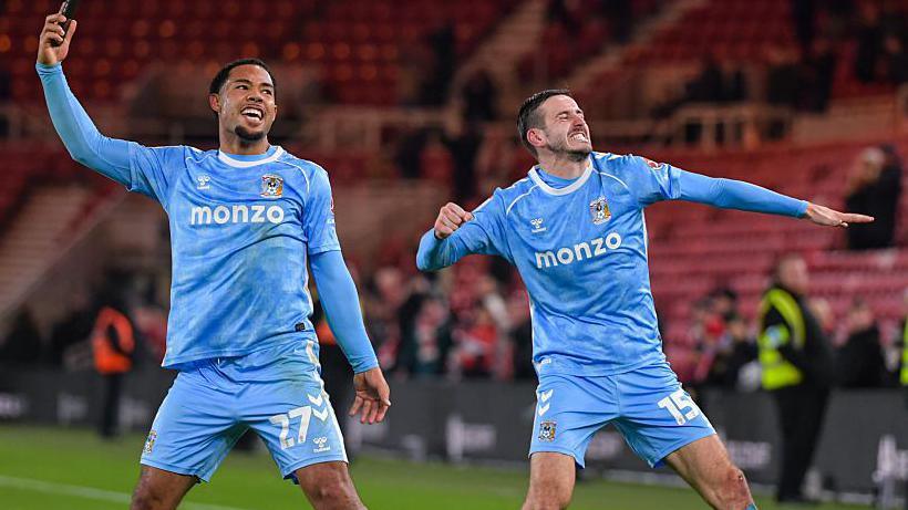 Coventry City players Milan van Ewijk and Liam Kitching punch the air to celebrate the team's win over MIddlesbrough.