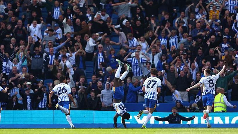 Carlos Baleba celebrates