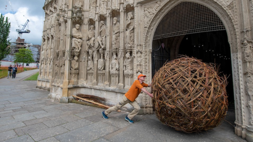 Martin Staniforth bringing his sculpture into the church