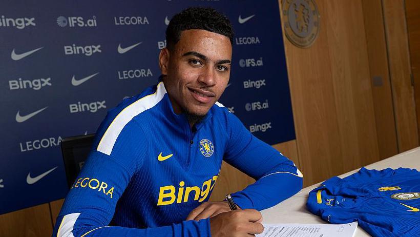 Morgan Rogers poses at Chelsea’s Cobham training ground after completing his move from Aston Villa