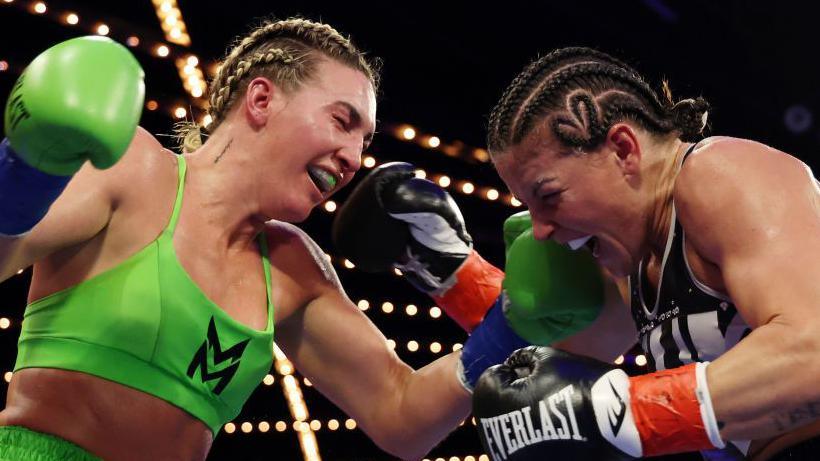 Mikaela Mayer and Sandy Ryan exchange shots in the ring