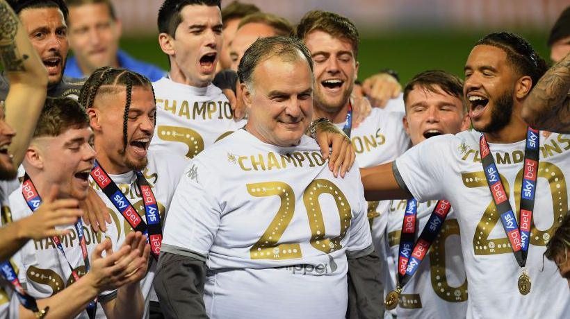 Marcelo Bielsa (centre) celebrates winning promotion to the Premier League in 2019-20