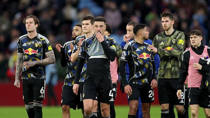 Several Leeds United players look dejected after a 1-1 draw against Aston Villa in the Premier League