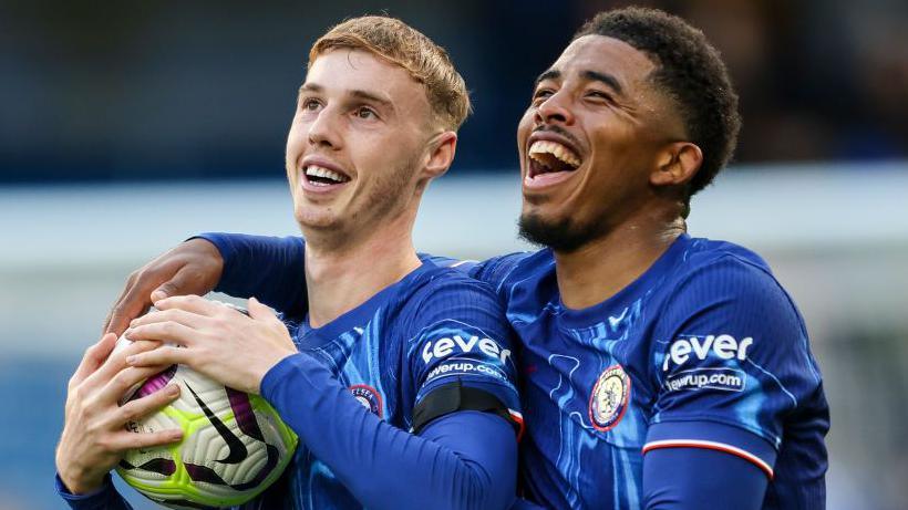 Cole Palmer celebrates with Wesley Fofana after Chelsea beat Brighton 4-2.