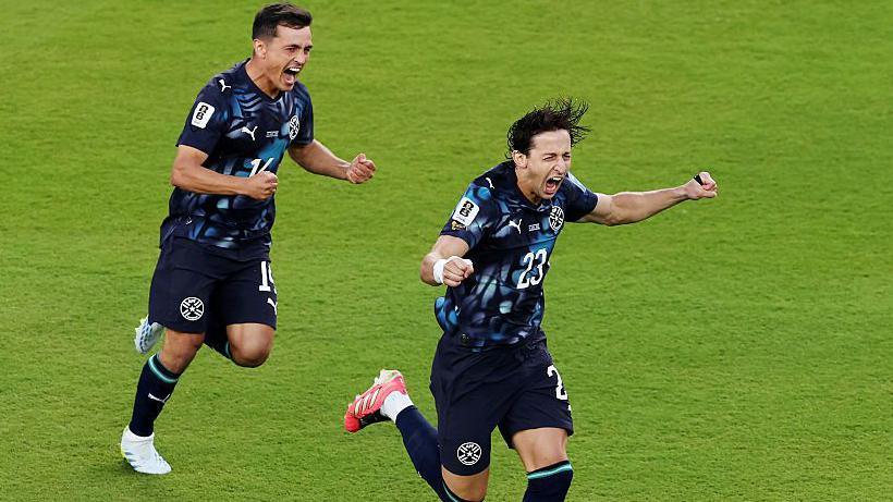 Matias Galarza celebrates his early goal for Paraguay against Turkey