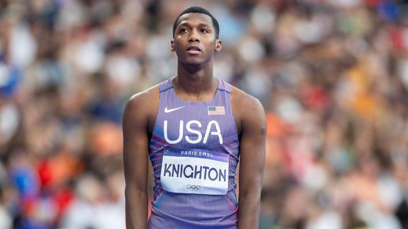 Erriyon Knighton wearing a purple vest