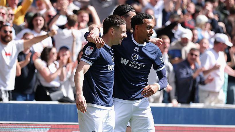 Camiel Neghli and Femi Azeez celebrate in front of the Millwall fans