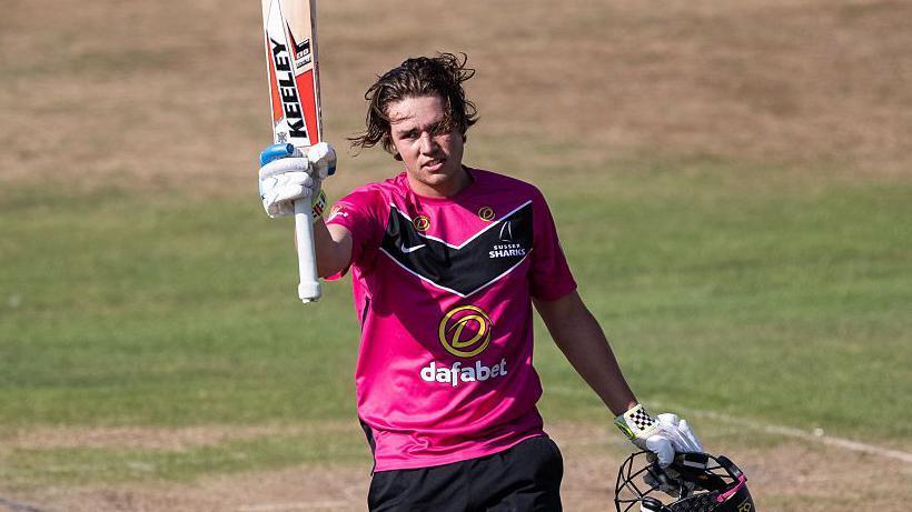 Charlie Tear celebrates his maiden List A century for Sussex at Northamptonshire