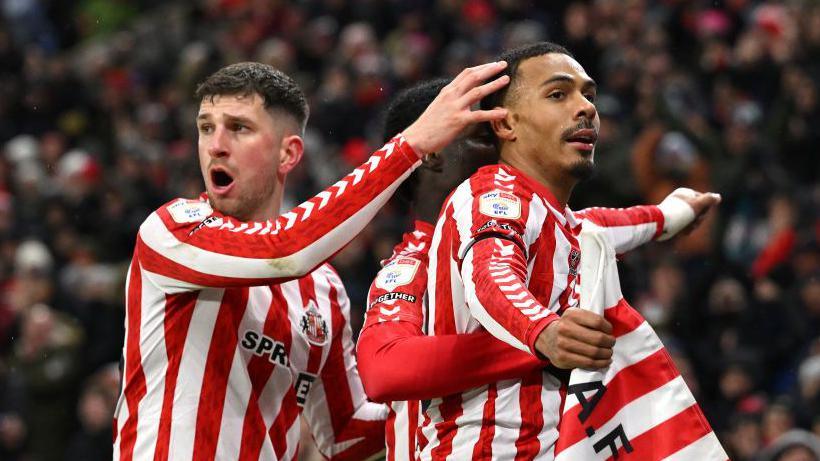 Sunderland players congratulate Wilson Isidor on his goal against Portsmouth