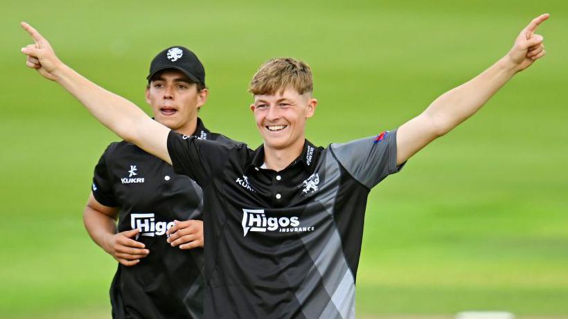 Alfie Ogborne celebrates taking a wicket for Somerset