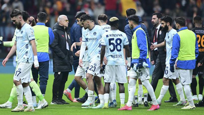 Adana Demirspor players withdraw from the field in the Turkish Super Lig match at Galatasaray